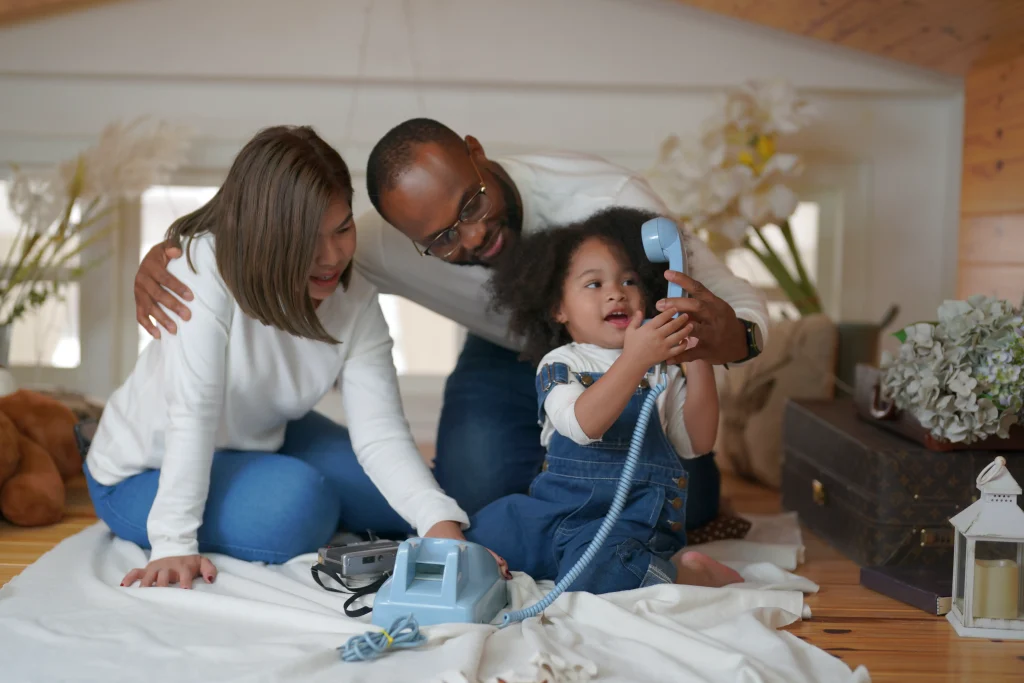 Family using a home phone in a Canadian living room